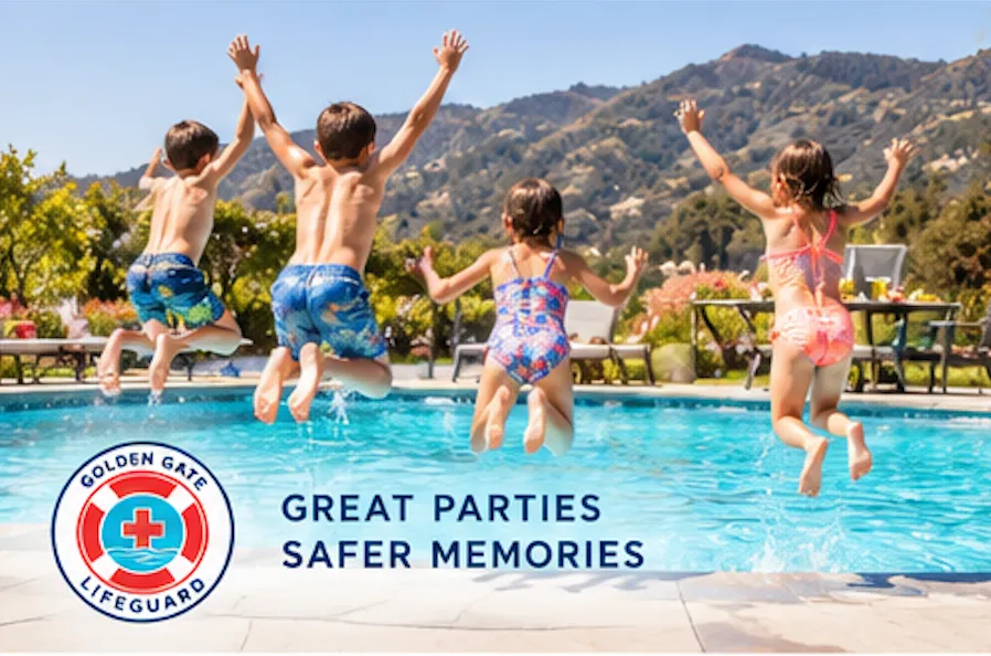 Four children leap into a swimming pool together with hills in the background.