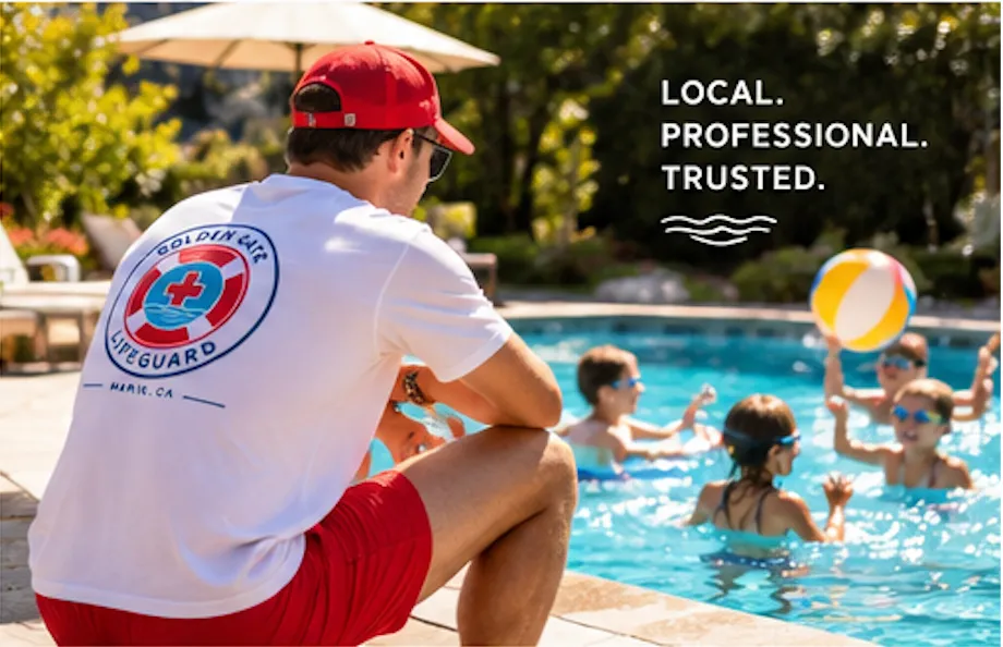 A Golden Gate Lifeguard staff member kneels poolside while children play in the water.